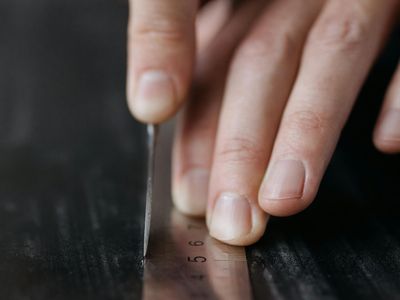 Close-up on hands in a precise, controlled position during exercise.